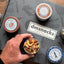 Damn Man Snack Box Gift Basket Assorted Baked Nuts Variety Pack in Tins 12 Count 24 Oz Total